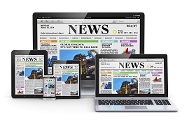Foto de um jornal em vários dispositivos de leitura